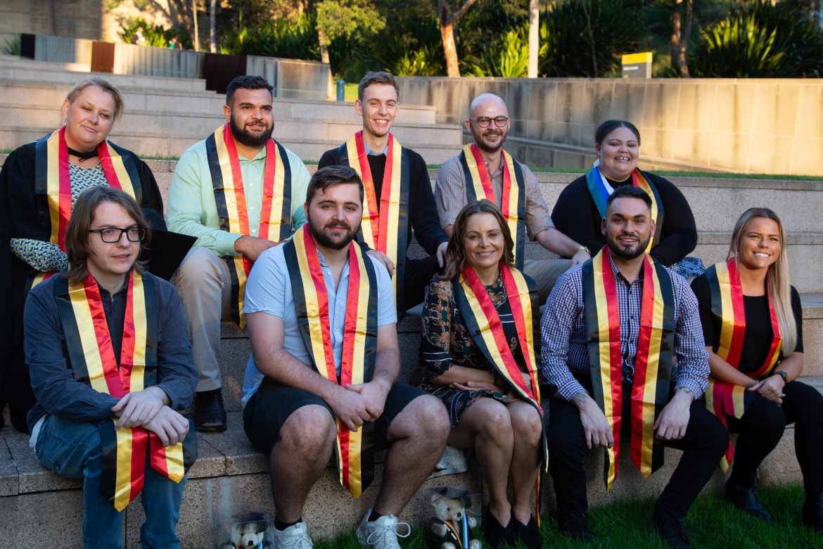 Indigenous graduates on steps at UNSW
