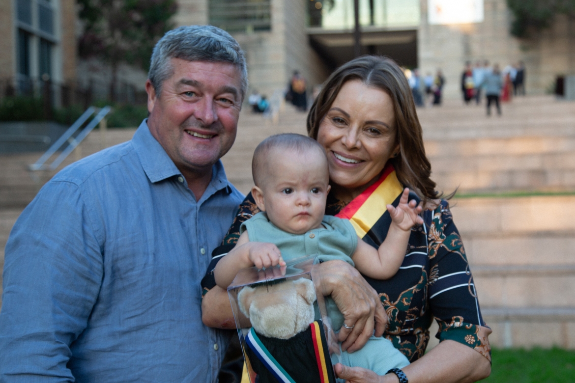 Indigenous graduate with family